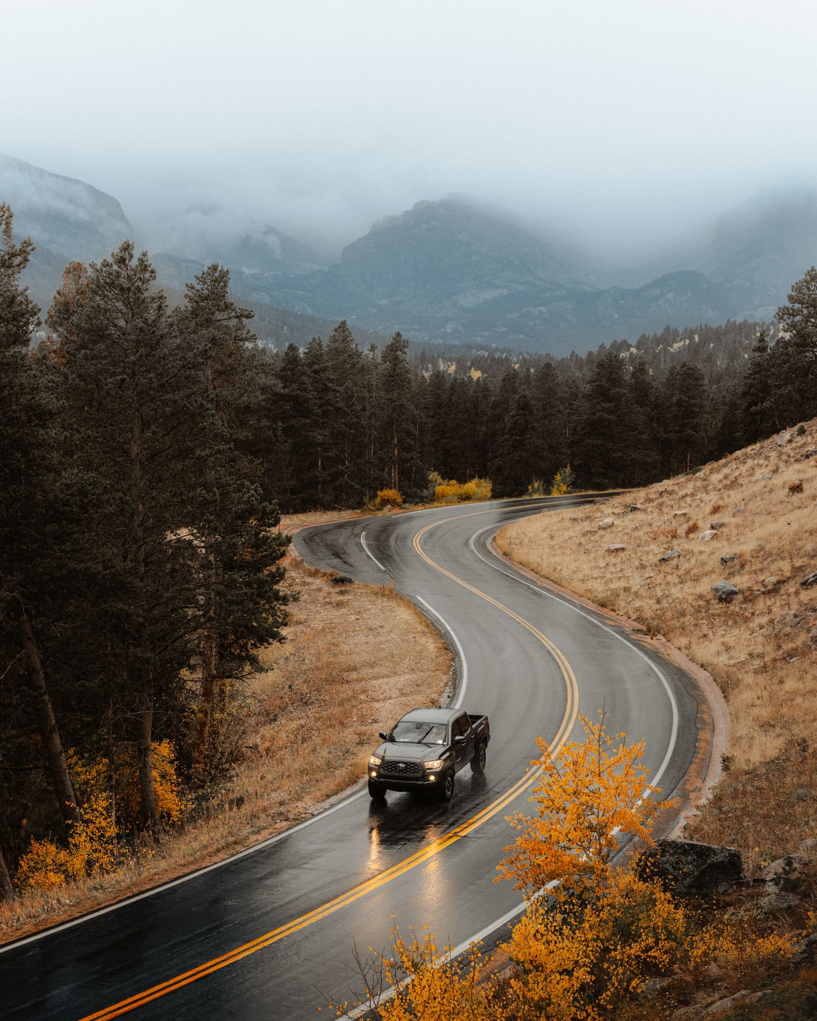 Car driving along a road through the mountains