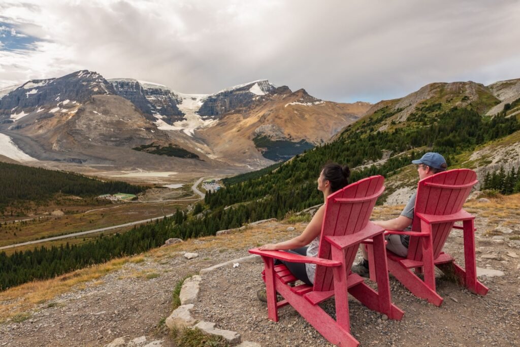 Couple looking out over the Columbia Icefield glacier landscape