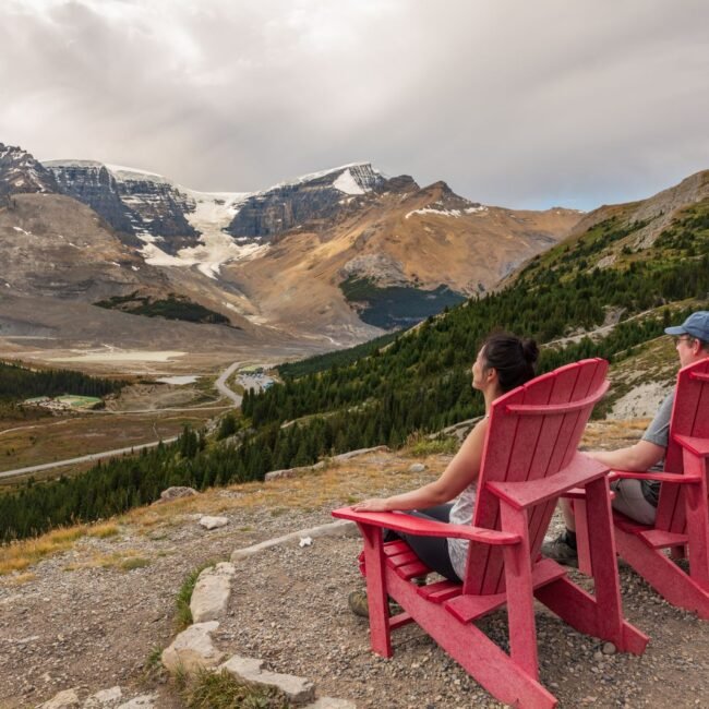 Couple looking out over the Columbia Icefield glacier landscape