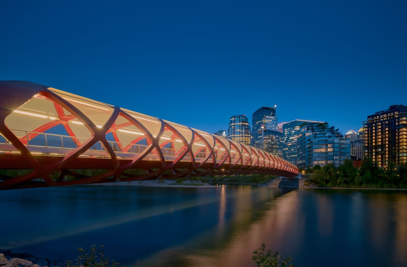 Peace Bridge at night with the Calgary skyline