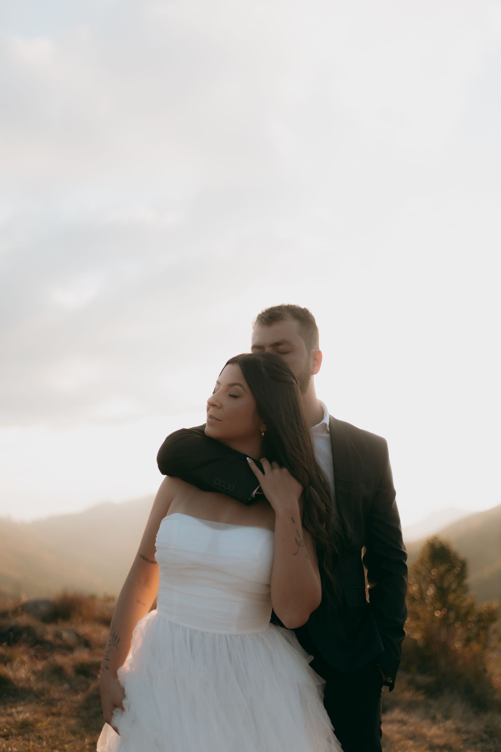 Wedding couple at a mountain wedding at sunset