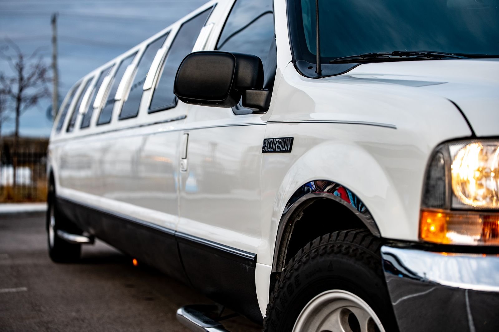 White stretch limousine parked on the street